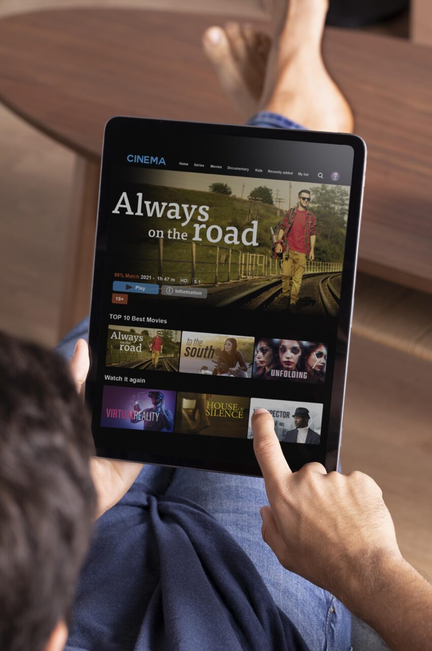 https://www.magnaquest.com/wp-content/uploads/2024/05/man-watching-streaming-service-his-tablet-850x1280.jpg